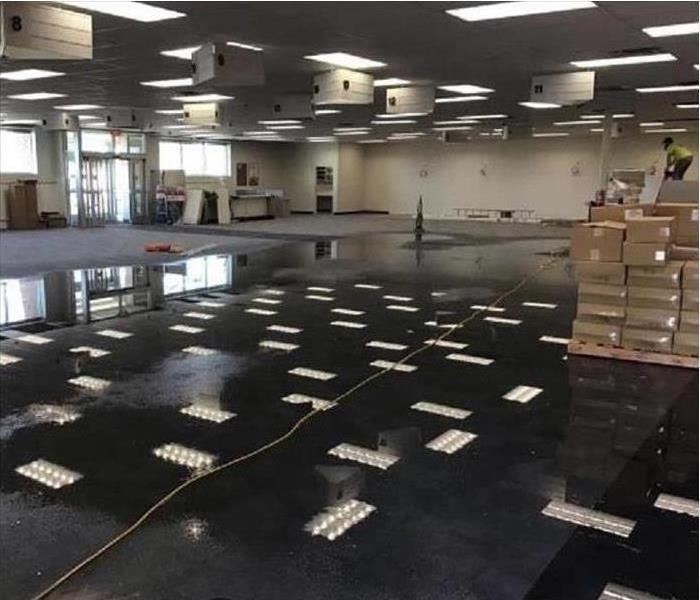 water on empty store carpet